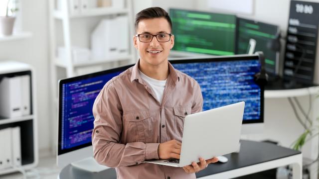 Person looking up from a computer screen